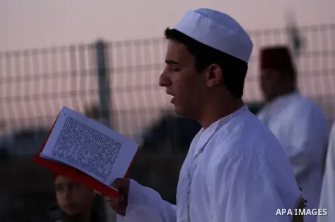 Members of the ancient Samaritan community, wrapped in a prayer shawl participate in the pilgrimage for the holy day of the Tabernacles or Sukkot at the religion's holiest site on the top of Mount Gerizim near the West B...