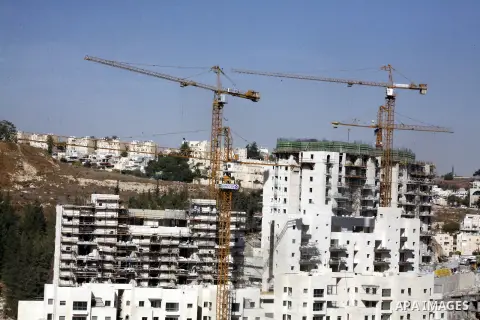 A part of work in Jewish settlement of Harmoun Hanatsave near the Arab neighbourhood of Ras al-Amud in Jerusalem on Oct. 30,2012. The Israeli occupation authority's approved to construct nearly 800 new settlement units i...