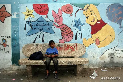 A Palestinian child waits his father outside a school after a school day in Rafah refugee camp southern the Gaza strip, Oct. 31, 2012. In the aftermath of the Israeli military Operation Cast Lead in 2008/2009, Palestinia...