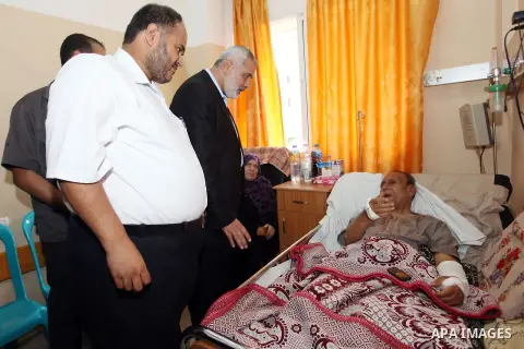 Palestinian Prime Minister in Gaza strip Ismail Haniyeh visits injured by Israeli airstrikes on Gaza strip at al-Shifa hospital in Gaza on Oct. 31, 2012. Israeli airstrikes killed many Palestinians and wounded others dur...
