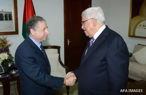 Palestinian President Mahmoud Abbas meets with the President of the Federation International Motor Sports Jean Todt at the Palestinian Authority headquarter in the West Bank city of Ramallah on Oct. 31, 2012. Photo by Th...
