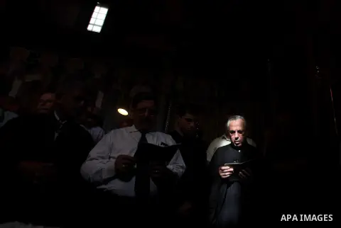 Palestinian relatives of Christian Hossam Al-Tawil mourn on his body during his funeral at the Church of Saint Porphyrius in Gaza city on Nov. 01, 2012. Al-Tawil passed away in Egypt after seeking medical treatment in th...