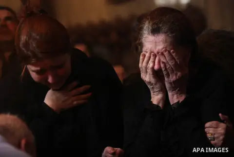 Palestinian relatives of Christian Hossam Al-Tawil mourn on his body during his funeral at the Church of Saint Porphyrius in Gaza city on Nov. 01, 2012. Al-Tawil passed away in Egypt after seeking medical treatment in th...