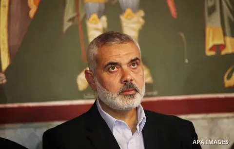 Palestinian Prime Minister in Gaza strip Ismail Haniyeh condoles the relatives of Christian Hossam Al-Tawil during his funeral at the Church of Saint Porphyrius in Gaza city on Nov. 01, 2012. Al-Tawil passed away in Egyp...