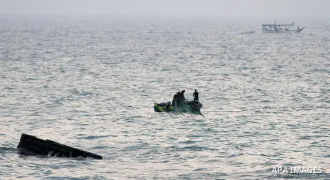 Palestinian refugee fishermen fish on their canoe at Gaza's coasts in Gaza City on November 2, 2012. The turbulent political conditions that prevailed in Palestine after Balfour Declaration up to 1948, have significantly...