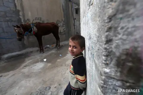 A Palestinian refugee boy stands outside his house in the Shati refugee camp in Gaza City on November 2, 2012. The turbulent political conditions that prevailed in Palestine after Balfour Declaration up to 1948, have sig...