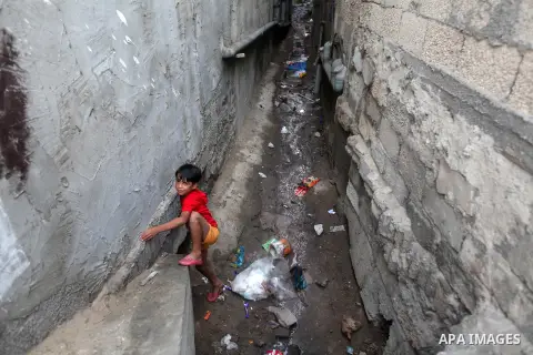 A Palestinian refugee boy plays outside his house in the Shati refugee camp in Gaza City on November 2, 2012. The turbulent political conditions that prevailed in Palestine after Balfour Declaration up to 1948, have sign...