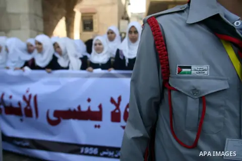 Palestinian students participate a protest on the massacre of Khan Younis 1956" in Khan Younis in southern Gaza city, on November 03, 2012. Organized Khan Younis Municipality in cooperation with the "Committee for commem...