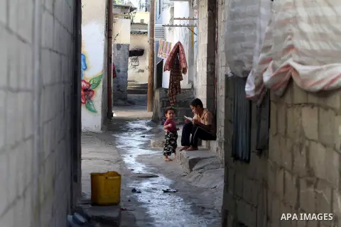 Palestinian children sit in an alley of the Shati Palestinian refugee camp in Gaza City on November 3, 2012. The issue of refugees is one of the thorniest elements of the Palestinian-Israeli conflict, with the Palestinia...