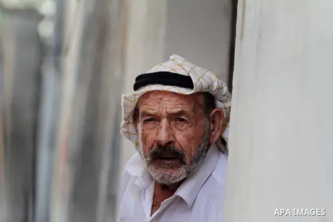 An elder Palestinian refugee man sits next her house at the Shati Palestinian refugee camp in Gaza City on November 3, 2012. The issue of refugees is one of the thorniest elements of the Palestinian-Israeli conflict, wit...