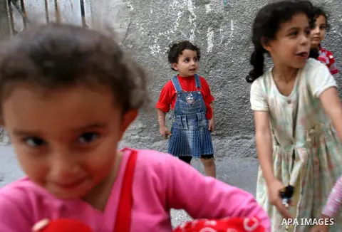 Palestinian refugee girls at the entrance to her house in the Rafah refugee camp in southern Gaza City on November 3, 2012. The turbulent political conditions that prevailed in Palestine after Balfour Declaration up to 1...