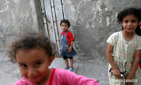 Palestinian refugee girls at the entrance to her house in the Rafah refugee camp in southern Gaza City on November 3, 2012. The turbulent political conditions that prevailed in Palestine after Balfour Declaration up to 1...