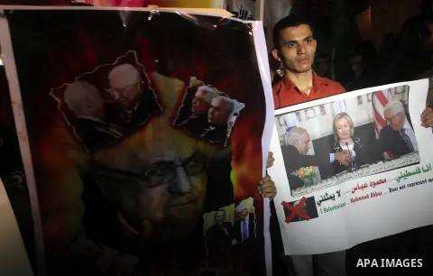 Hamas supporters attend a rally against Palestinian President Mahmoud Abbas in Gaza City November 3, 2012. Abbas made a rare if symbolic concession to Israel on Thursday, saying he had no permanent claim on the town from...