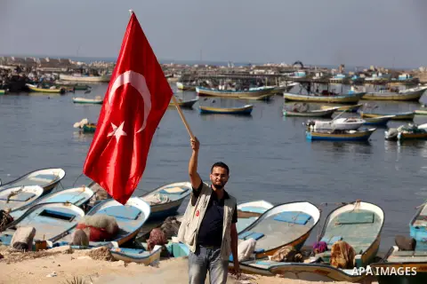 A Palestinian man a protests against trial proceedings criminals Marmara massacre in Gaza port, on Nov. 04, 2012 . Photo by Ashraf Amra