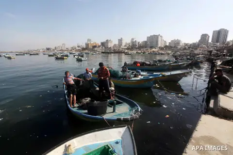 Palestinian fishermen enjoy their fishing time on the sea, during press conference about trial proceedings criminals Marmara massacre in Gaza port, on Nov. 04, 2012. Photo by Ashraf Amra