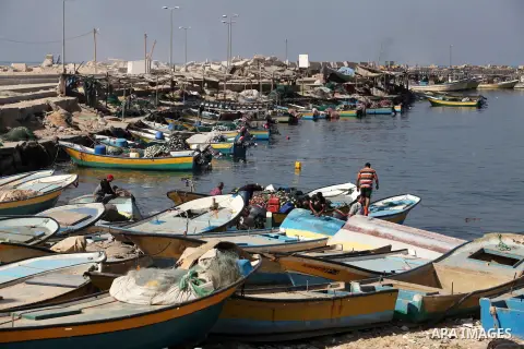 Palestinian fishermen enjoy their fishing time on the sea, during press conference about trial proceedings criminals Marmara massacre in Gaza port, on Nov. 04, 2012. Photo by Ashraf Amra