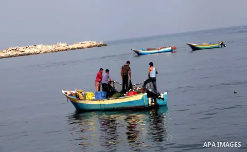 Palestinian fishermen enjoy their fishing time on the sea, during press conference about trial proceedings criminals Marmara massacre in Gaza port, on Nov. 04, 2012. Photo by Ashraf Amra