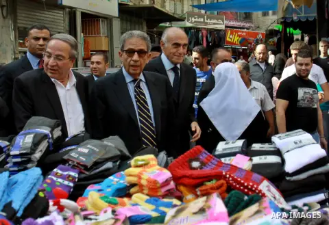 Egyptian politician and former Arab League secretary general, Amr Moussa walks around in the old town market in the west bank city of Nablus on November 4, 2012. Photo by Nedal Eshtayah