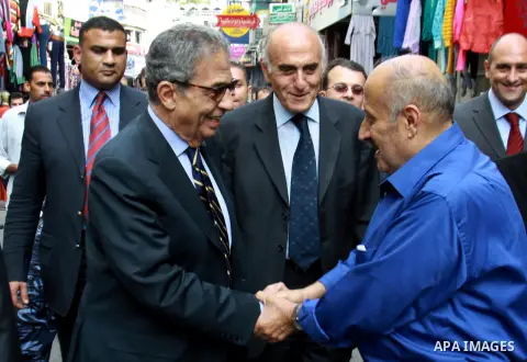 Egyptian politician and former Arab League secretary general, Amr Moussa walks around in the old town market in the west bank city of Nablus on November 4, 2012. Photo by Nedal Eshtayah