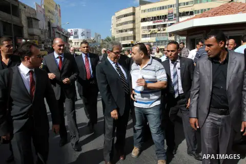Egyptian politician and former Arab League secretary general, Amr Moussa walks around in the old town market in the west bank city of Nablus on November 4, 2012. Photo by Nedal Eshtayah