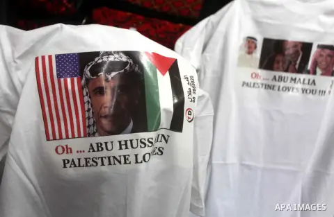 A Palestinian shop owner displays mugs for sale with portraits of leaders including US President Barack Obama, at a souvenir shop in Gaza City on Nov. 07, 2012. Democratic President Obama defeated Republican candidate Mi...