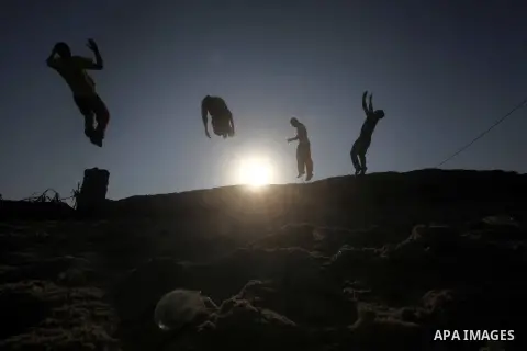 Palestinians youth practice his parkour skills, also known as free running, in the town of Khan Younis, in the southern Gaza Strip, on November 8, 2012. Some youths, aged between 12 and 23 years old, in Gaza are pracitis...