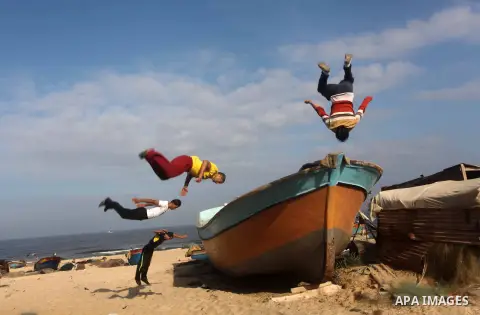 Palestinians youth practice his parkour skills, also known as free running, in the town of Khan Younis, in the southern Gaza Strip, on November 8, 2012. Some youths, aged between 12 and 23 years old, in Gaza are pracitis...