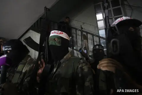 Palestinian masked gunmen, belonging to the Popular Resistance Committees (PRC), attend a press conference in Gaza City on November 11, 2012. The outbreak of violence was one of the most serious since Israel's devastatin...