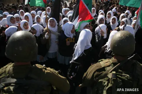 Palestinian students clash with Israeli soldiers during a demonstration in near the West Bank city of Hebron in Fawwar camp on Nov. 14, 2012, to mark the 24th anniversary of the Palestinian Independence Day. Palestinians...
