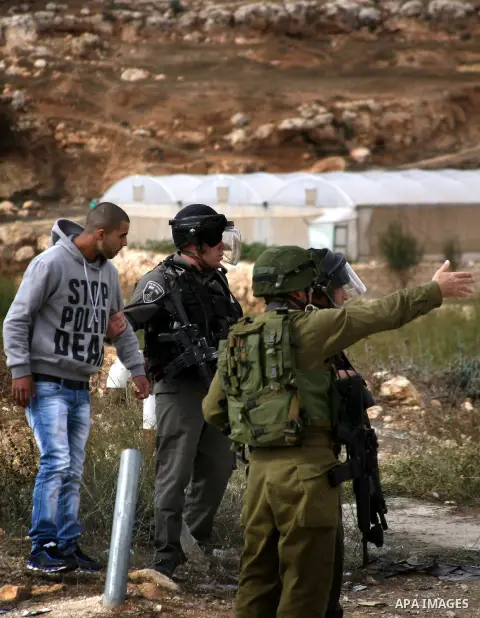 Palestinian students clash with Israeli soldiers during a demonstration in near the West Bank city of Hebron in Fawwar camp on Nov. 14, 2012, to mark the 24th anniversary of the Palestinian Independence Day. Palestinians...
