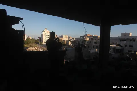 Palestinians check their damaged house after Israeli air strikes in Gaza City November 15, 2012. Israel exchanged the fiercest fire with Hamas in years after assassinating its military mastermind and threatening a wider...