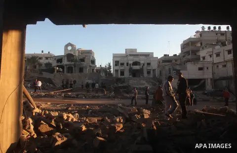 Palestinians check their damaged house after Israeli air strikes in Gaza City November 15, 2012. Israel exchanged the fiercest fire with Hamas in years after assassinating its military mastermind and threatening a wider...