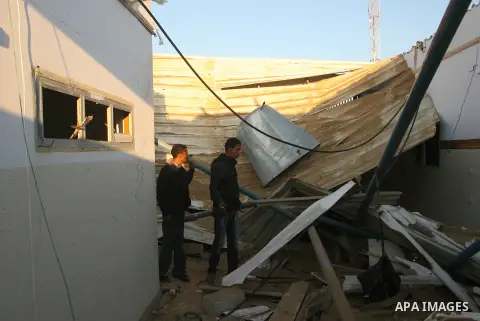 Palestinians inspect the damage in their house hit by a missile fired by Israeli air forces in the southern of Gaza strip town of Rafah, November 15, 2012. Several Palestinians were killed following a series of Israel's...