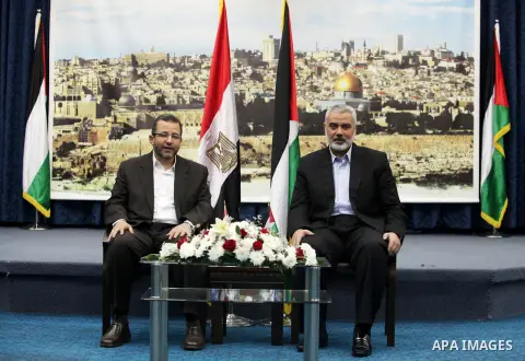 Palestinian Prime Minister in the Gaza Strip Ismail Haniya receives Egyptian Prime Minister Hisham Qandil in Gaza City, on November 16, 2012 . Egyptian premier Hisham Qandil vowed to intensify Cairo's efforts to secure a...