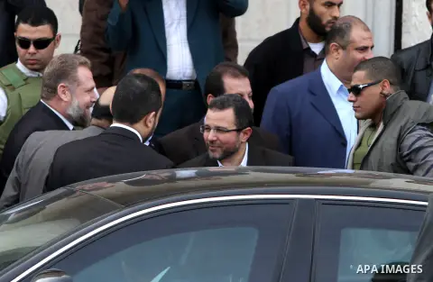 Egyptian Egyptian Prime Minister Hesham Kandil shakes hands with Palestinian leaders during his visit to Gaza strip, in Gaza City, on November 16, 2012 . Egyptian premier Hisham Qandil vowed to intensify Cairo's efforts...