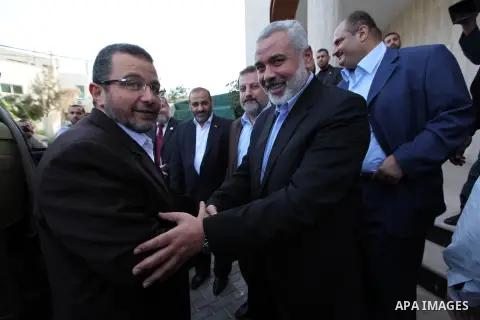 Palestinian Prime Minister in the Gaza Strip Ismail Haniya receives Egyptian Prime Minister Hisham Qandil in Gaza City, on November 16, 2012 . Egyptian premier Hisham Qandil vowed to intensify Cairo's efforts to secure a...