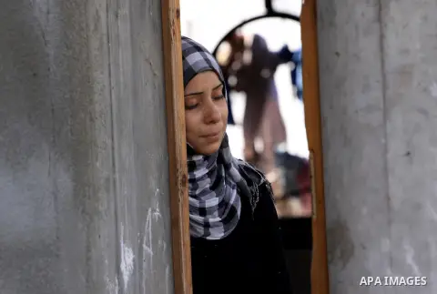 Palestinian women of Audi Naser 10 years, cries during his funeral after he was killed in an Israeli air strike, during his funeral in Beit Hanun, northern Gaza Strip on 16 November 2012. Missiles continue to be fired on...
