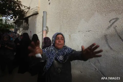 Palestinian women cry during the funeral of Tahrer Salman and Mohammed Salman in Beit Lahia, north Gaza, Friday, Nov. 16, 2012. According to relatives, the two members of the Salman family were killed after an Israeli ai...