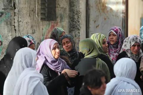 Palestinian women cry during the funeral of Tahrer Salman and Mohammed Salman in Beit Lahia, north Gaza, Friday, Nov. 16, 2012. According to relatives, the two members of the Salman family were killed after an Israeli ai...