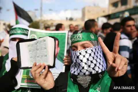 Hundreds of students from Hebron University some shouting and holding up the Palestinian flag demonstrate against the Israeli military attacks on the palestinian Gaza strip, in the West Bank town of Hebron, on November 1...