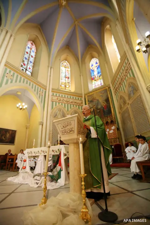 Bishop William Shomali lead a Mass to pray for the children of Gaza, in the Church of the Annunciation in the West Bank city of Beit Jala, on November 18, 2012. Israeli aircraft killed five Palestinian children in on Sun...