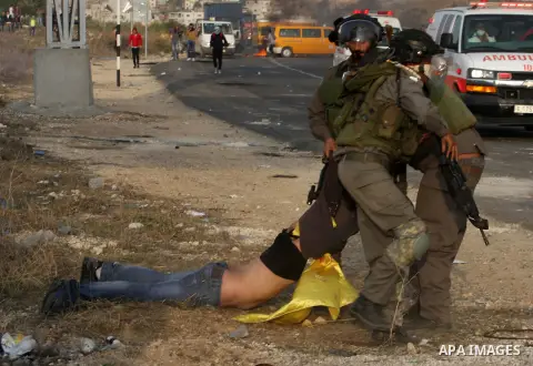 Israeli soldiers arrest a Palestinian protester during clashes following a protest against Israel's operations in the Gaza Strip, at Howwara checkpoint near Nablus, the West Bank, 18 November 2012. Reports state that the...