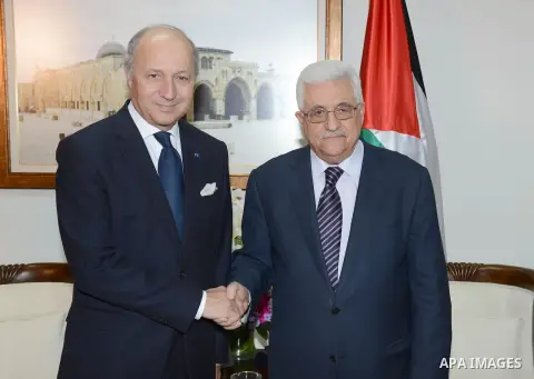 Palestinian President Mahmoud Abbas meets with French Foreign Minister, in the West Bank city of Ramallah, November 18, 2012. Photo by Thaer Ganaim
