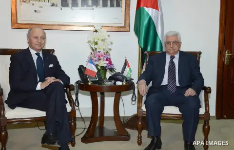 Palestinian President Mahmoud Abbas meets with French Foreign Minister, in the West Bank city of Ramallah, November 18, 2012. Photo by Thaer Ganaim