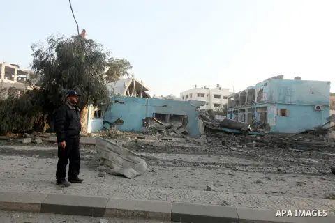 A Palestinian policeman surveys the remains of a destroyed police station after Israeli air strike in al-Shijaia in the east of Gaza city on, 19 November 2012. The Palestinian civilian death toll mounted Monday as Israel...