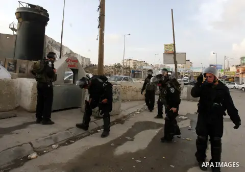Israeli border policemen shoots a tear gas canister at Palestinian protesters during a Palestinian protest at Damascus Gate in East Jerusalem, 18 November 2012, showing solidarity with the Palestinians in the Gaza Strip,...