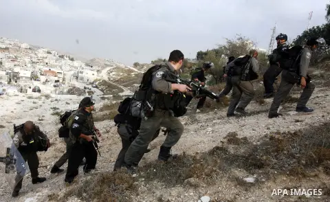 Israeli border policemen shoots a tear gas canister at Palestinian protesters during a Palestinian protest at Damascus Gate in East Jerusalem, 18 November 2012, showing solidarity with the Palestinians in the Gaza Strip,...