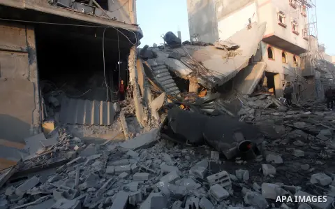 Palestinians search the debris of a destroyed home following an Israeli air strike in Gaza City, on November 19, 2012. Israeli air strikes on Sunday killed 31 Palestinians in the bloodiest day so far of its air campaign...