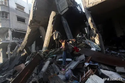 Palestinians search the debris of a destroyed home following an Israeli air strike in Gaza City, on November 19, 2012. Israeli air strikes on Sunday killed 31 Palestinians in the bloodiest day so far of its air campaign...