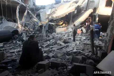Palestinians search the debris of a destroyed home following an Israeli air strike in Gaza City, on November 19, 2012. Israeli air strikes on Sunday killed 31 Palestinians in the bloodiest day so far of its air campaign...